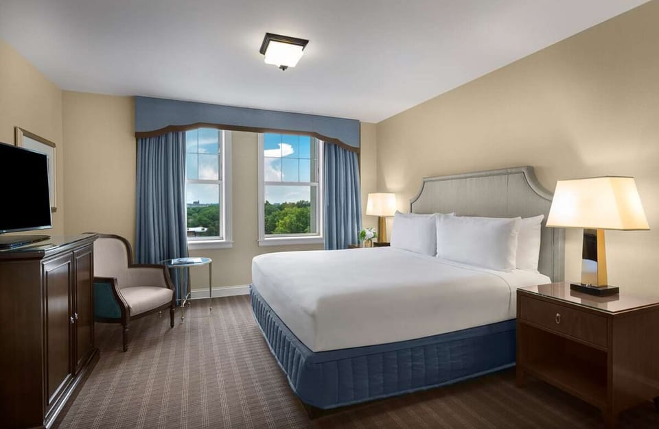 Recharge in a quiet king room with soothing park views.