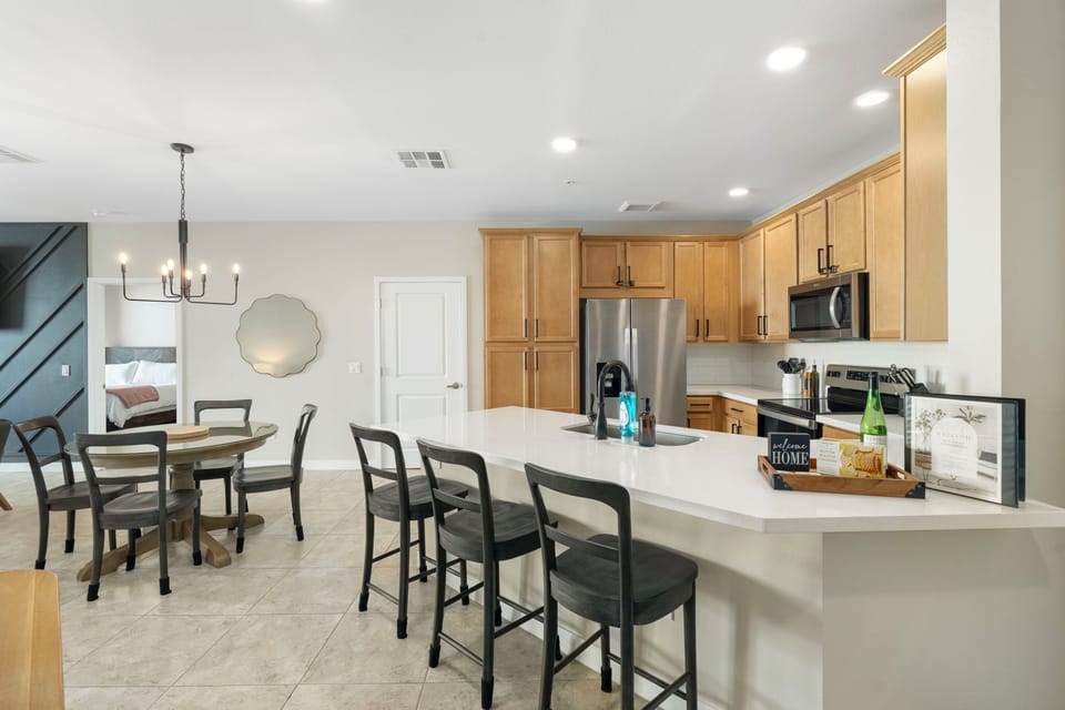 Eat together at the dining table or up at the sleek stone breakfast bar
