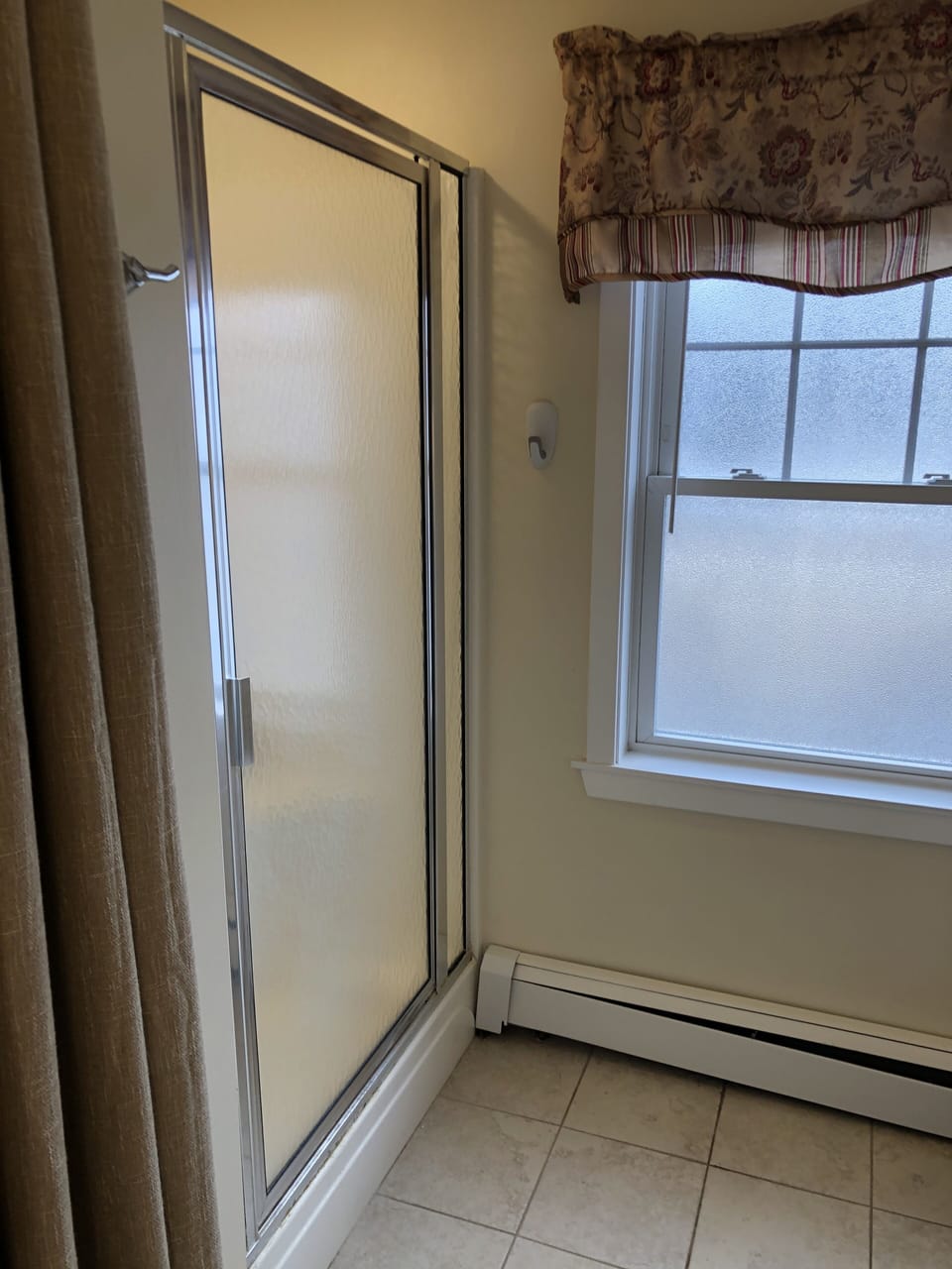 The main floor bathroom has a spacious shower