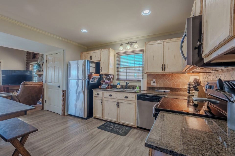 View as you're walking in the front door. Stocked kitchen....just bring your groceries!