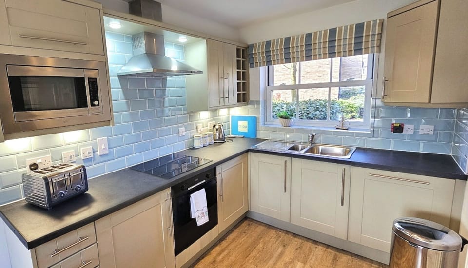 Our kitchen area with Oven, Hob, Dishwasher, Microwave, Toaster & Kettle. 