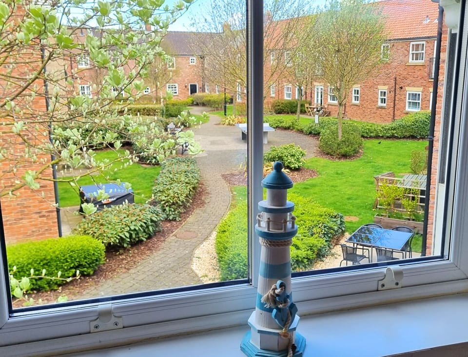 The outside courtyard (with shared table tennis table) from bedroom three. 