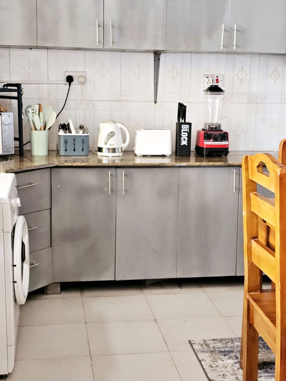 It's a full functional kitchen with  the necessary appliances for your  cooking!