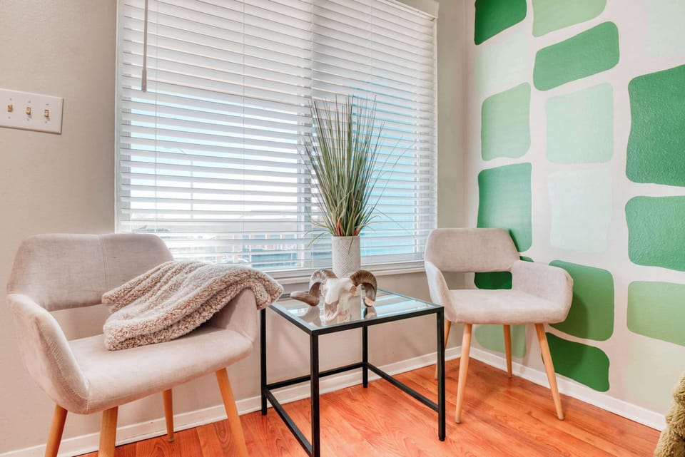 To complete the look, lush plants bring a natural, vibrant feel, while soft throws add warmth and comfort.