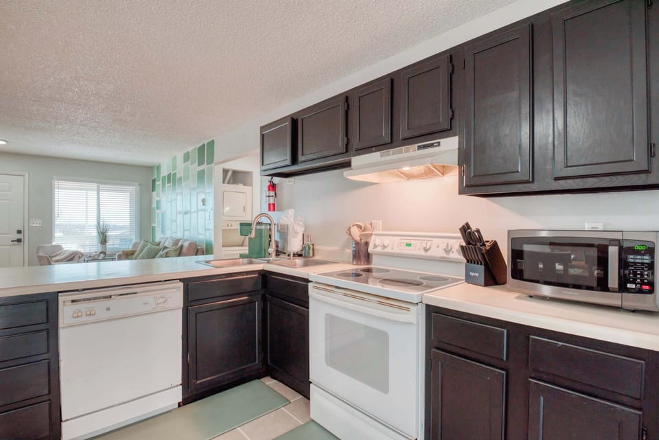 Whether you're a foodie, wine lover, or coffee enthusiast, this kitchen has everything you need for a comfortable and stylish stay.