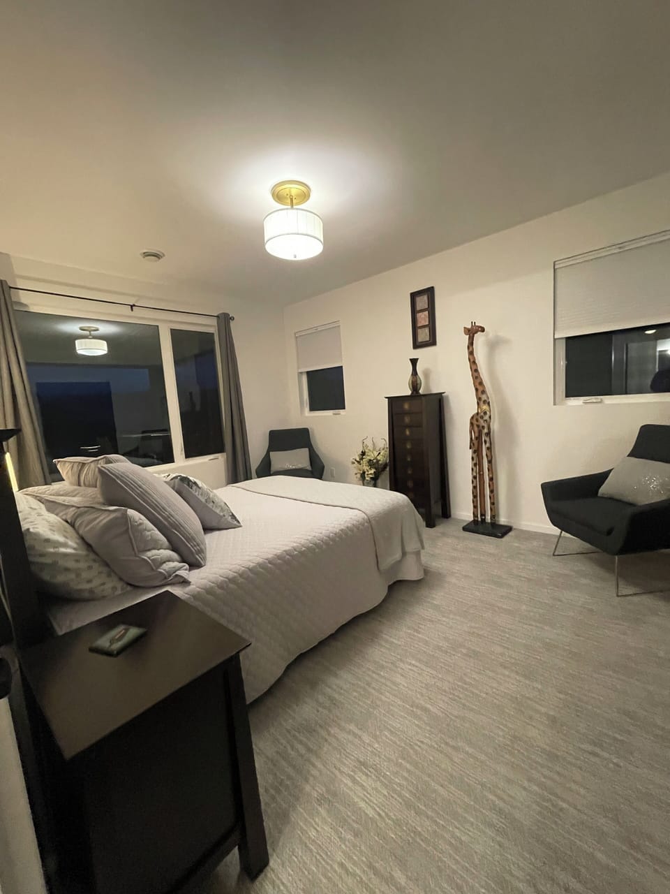 Large bedroom with a cozy Queen bed and walk in closet