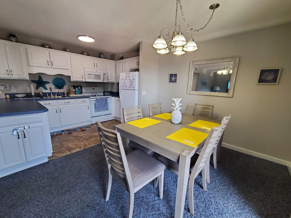 Open area from dining table to kitchen.