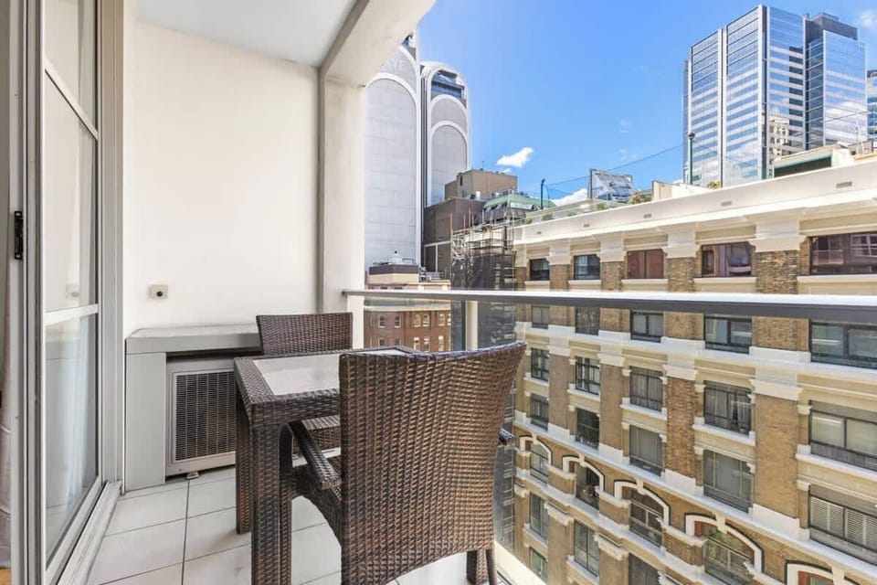 A private balcony with a setting.