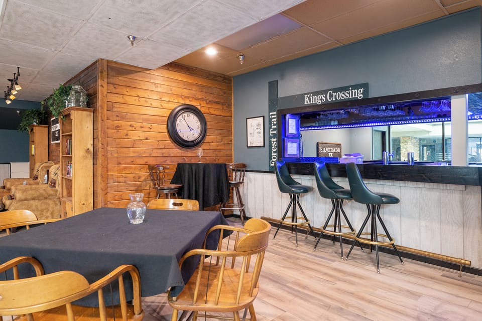 Enjoy your morning coffee at this cozy bar counter or gather around the dining table in this warm communal space.