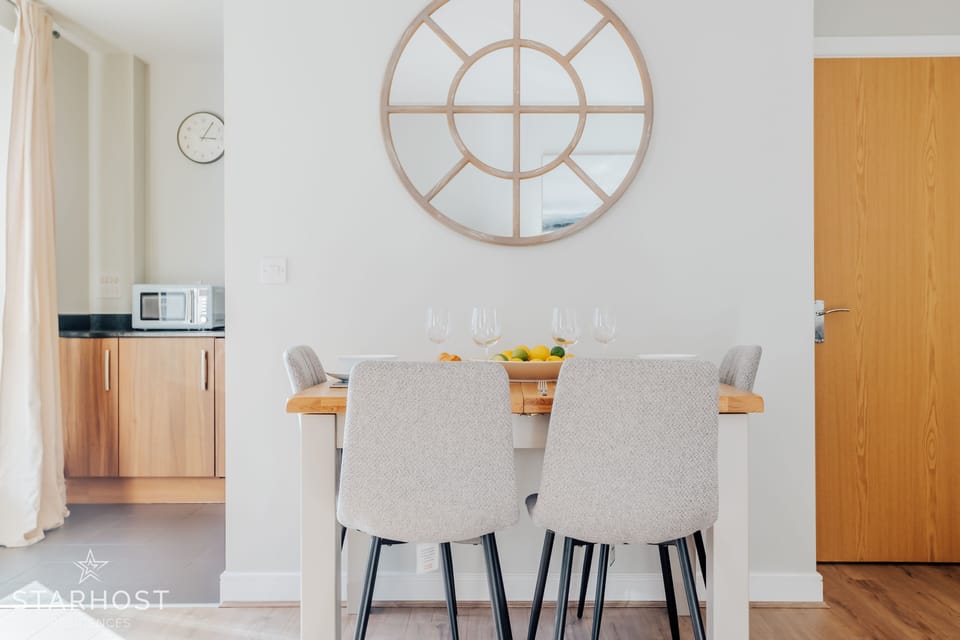 The living area includes an extending dining table, which can seat 4 guests