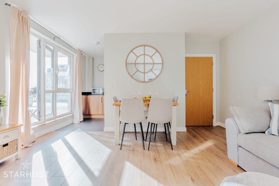 The living room provides access to the kitchen, with a range of appliances