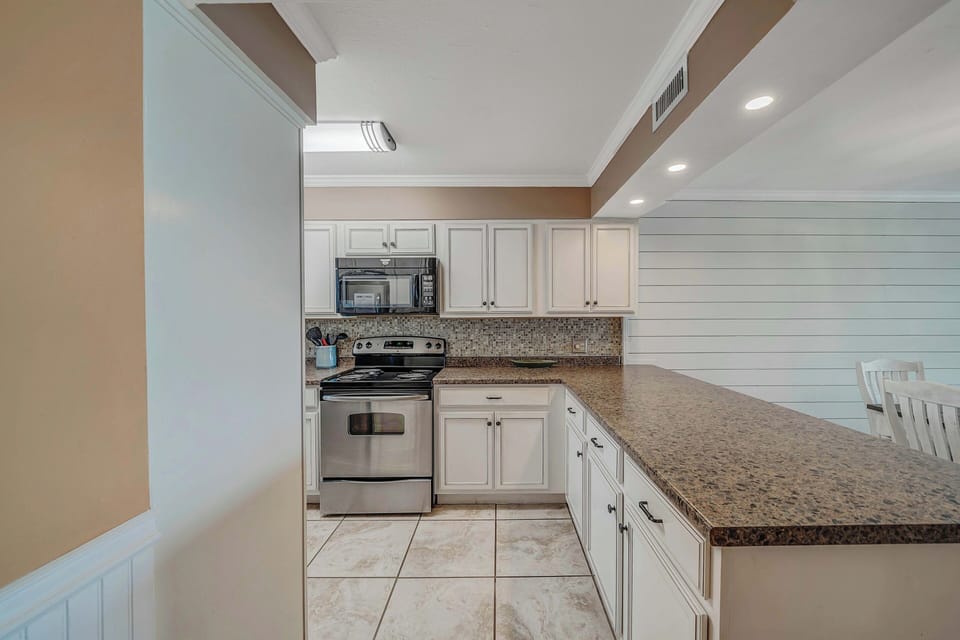 The fully equipped kitchen features stainless-steel appliances and has everything you need to prepare meals for family & friends.