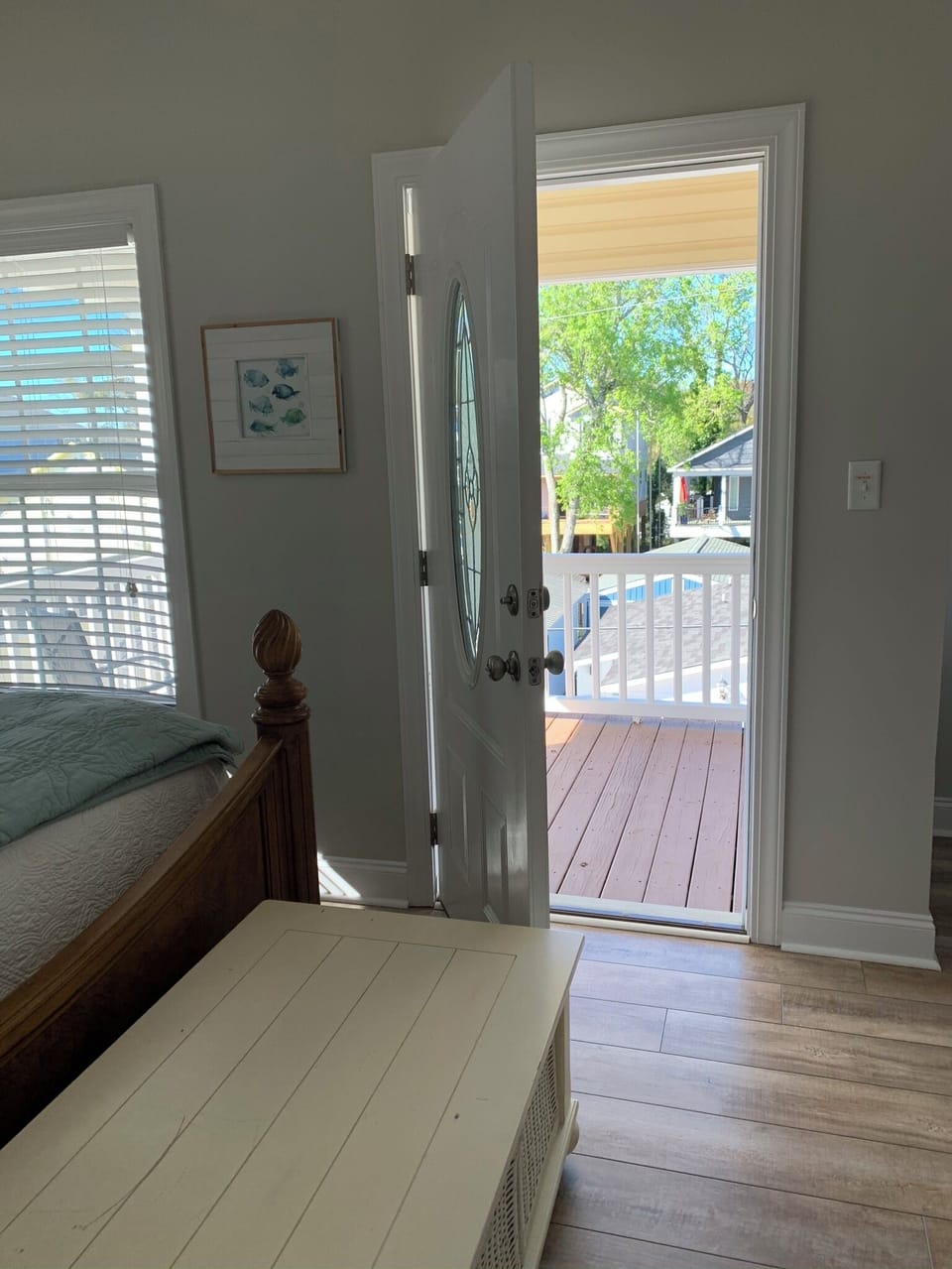 Upstairs king bedroom showing door to private deck with sitting area