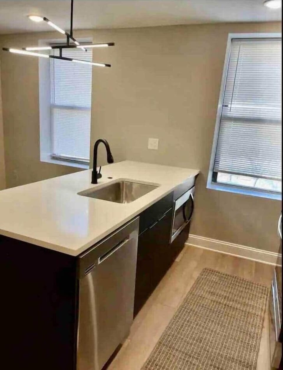 Check out our stunning, brand-new kitchen! It’s spacious and fully loaded with all the amenities you need, plus a breakfast bar and a dining table for meals and hangouts. Perfect for whipping up your favorite dishes or enjoying a nice meal!