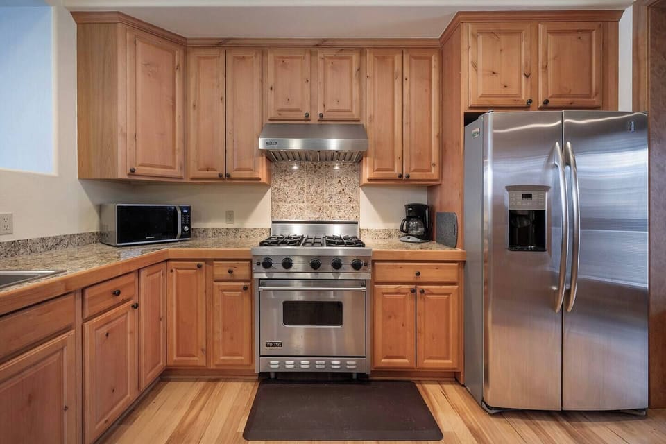 Kitchen is on second floor between family room and there is a side nook with fireplace and balcony