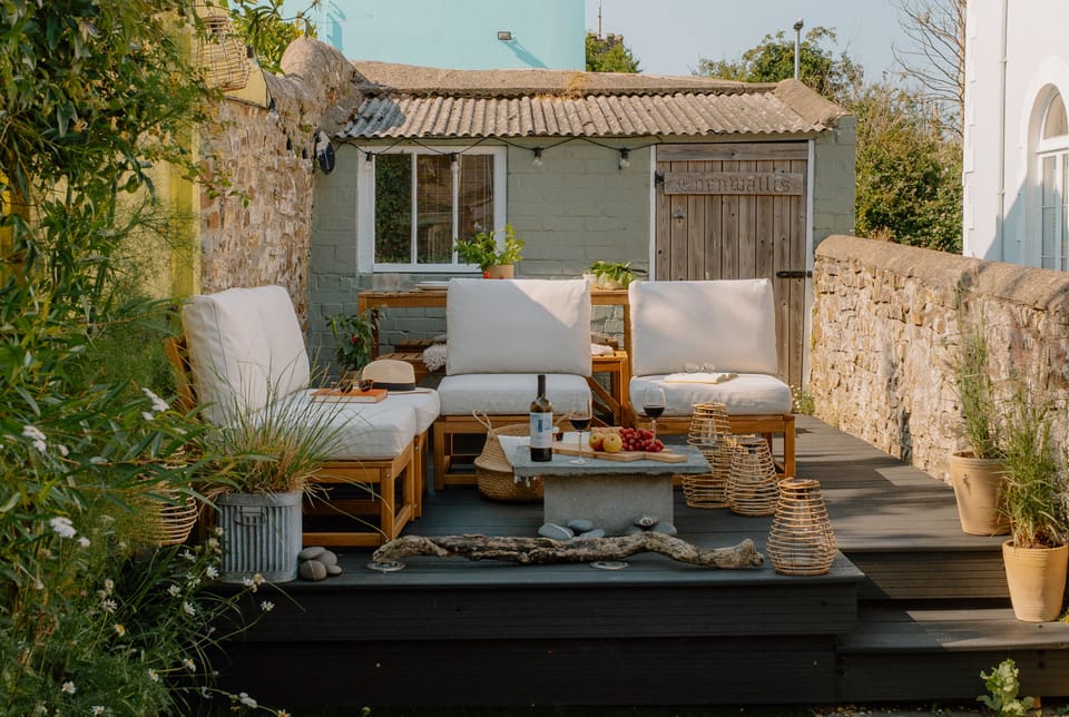 Enclosed walled garden, with decked entertaining area, small lawn and patio. 