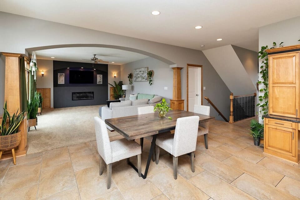 Open Dinning & Living Room w/ 65 inch TV and electric fireplace