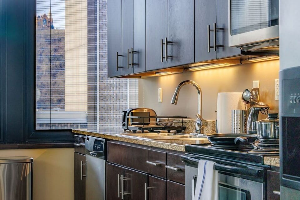Fully-equipped kitchen boasting new stainless steel appliances (oven, stove, refrigerator, dishwasher, microwave, garbage disposal) toaster, coffee maker, free coffee, pots and pans, dishware, silverware—everything you need to start cooking on day one!