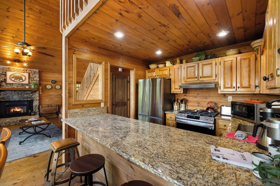 Gorgeous cabin kitchen with stainless steel appliances and mountain views