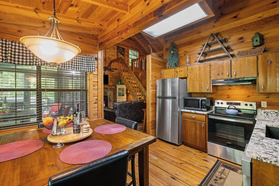 A picture-perfect view of Cherry Lake makes the dining area a highlight of this romantic cabin rental in Blue Ridge