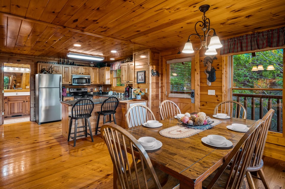 Dining area with table and chairs. Easy access to kitchen.