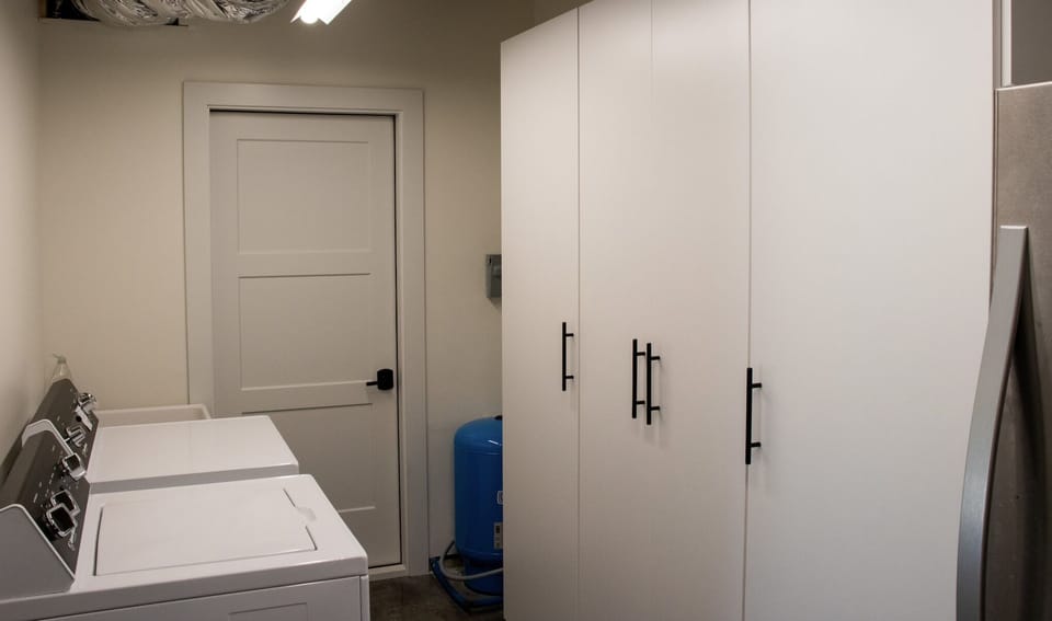 Laundry Room + 2 refrigerator off of downstairs living area
