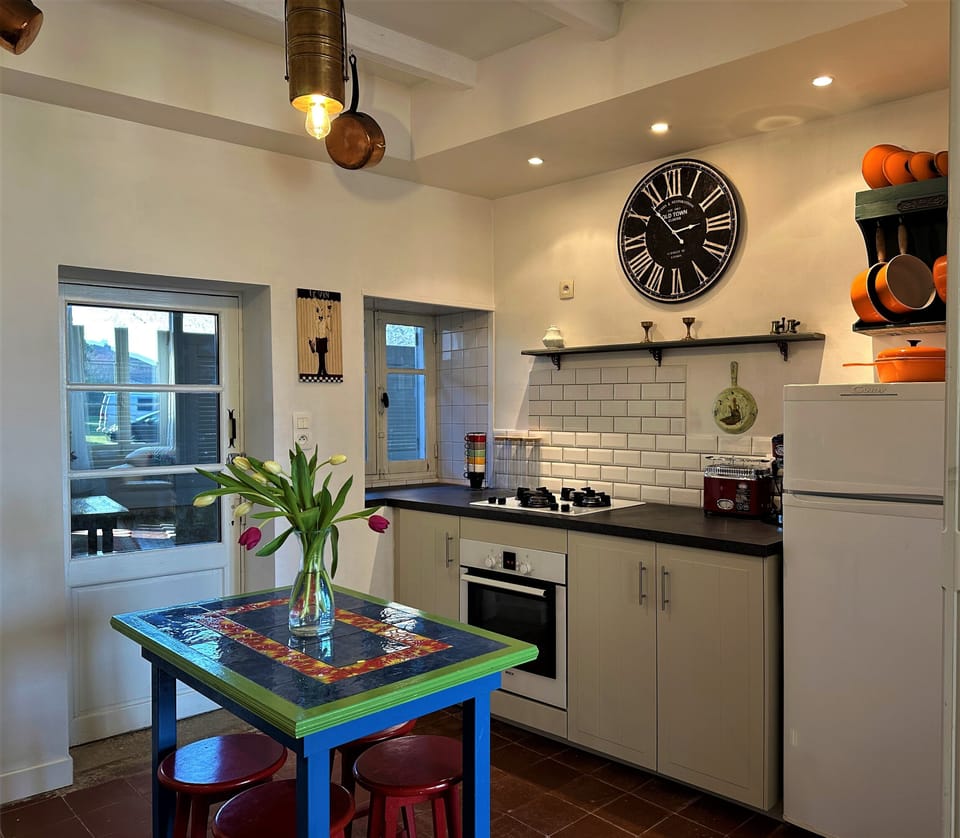 The kitchen is perfect for a breakfast and opens to the salon and the deck.