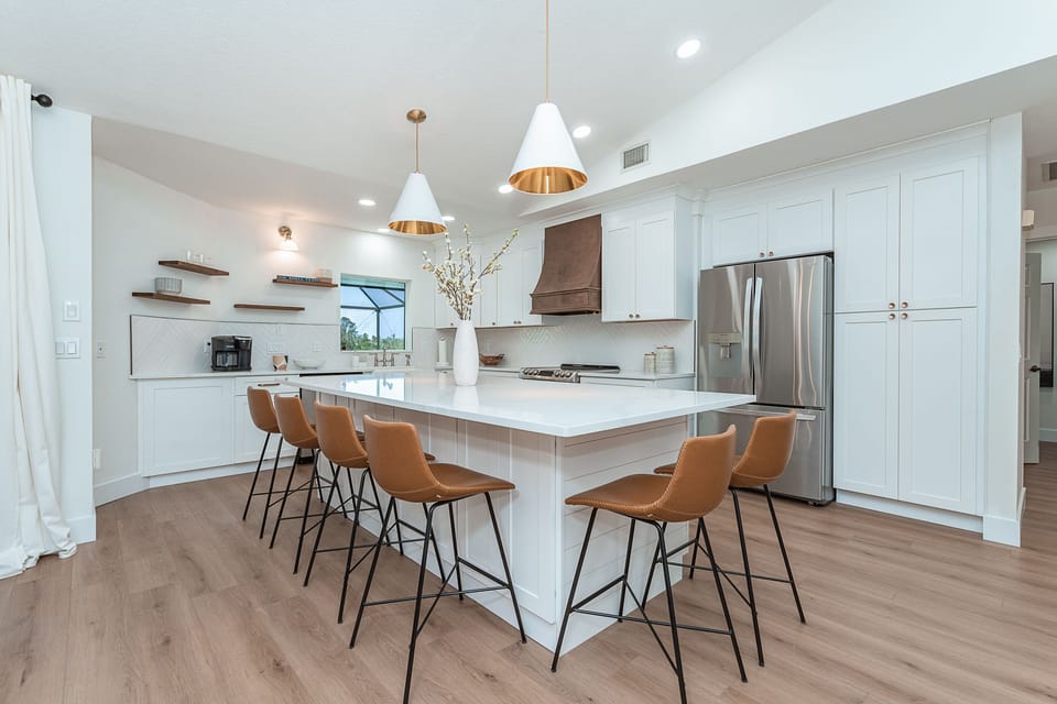 Seating for 6 on the massive island with quartz counter tops!