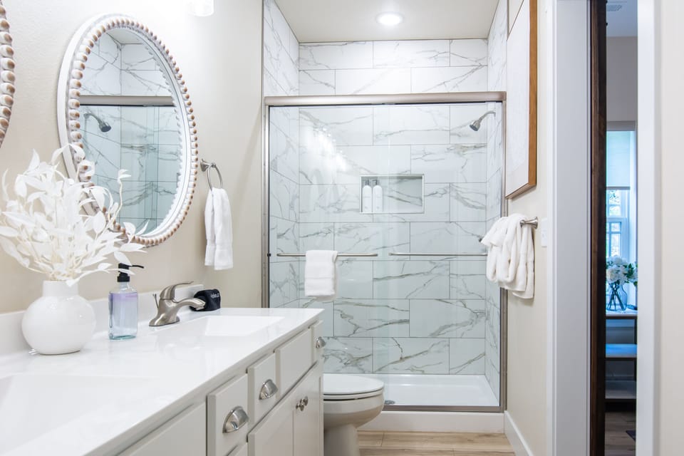 Main level en suite bathroom with step in shower