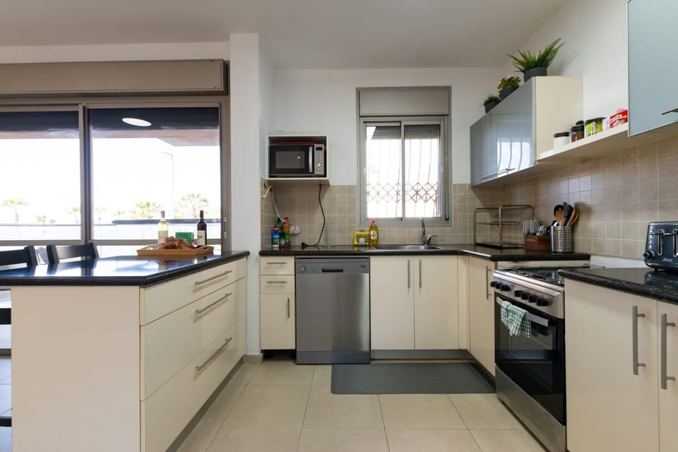 Fully equipped kitchen makes cooking easy before heading out to enjoy nearby restaurants and walks