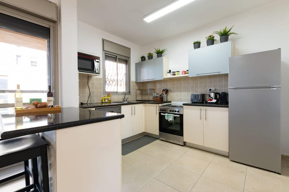 Well organized kitchen corner offers needed for preparing meals while staying close to seaside attractions