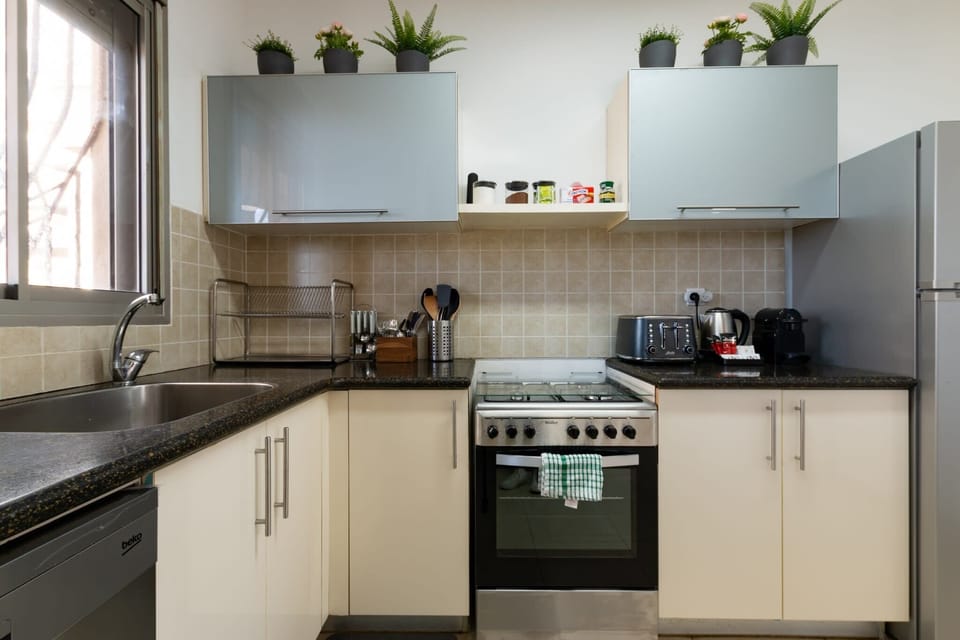 Functional kitchen layout with oven and storage makes extended stays comfortable and convenient for families
