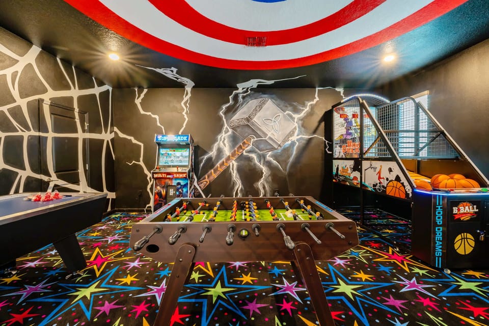 Experience the thrill in a superhero-themed game room packed with foosball, arcade games, and basketball fun!