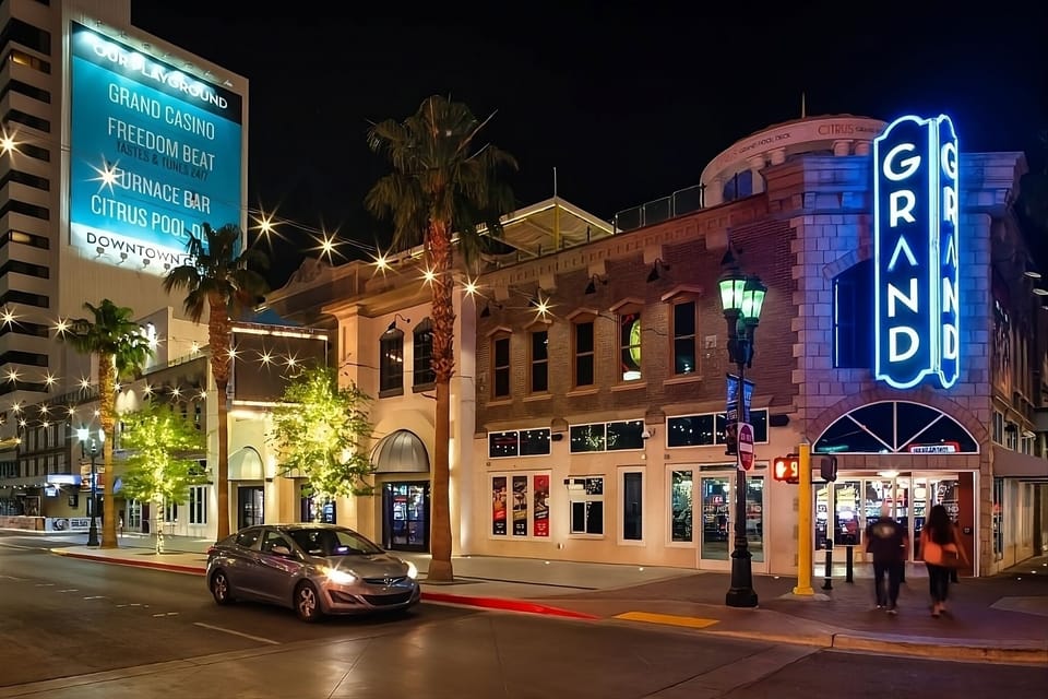 Arrive to bright lights and an iconic downtown corner entrance.