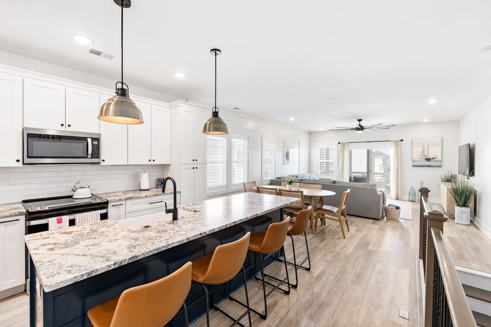 A bright, modern & open space kitchen and living room space 