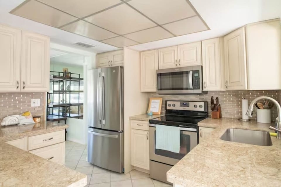 Well stocked kitchen with new dishes, pots, pans, cutlery.  