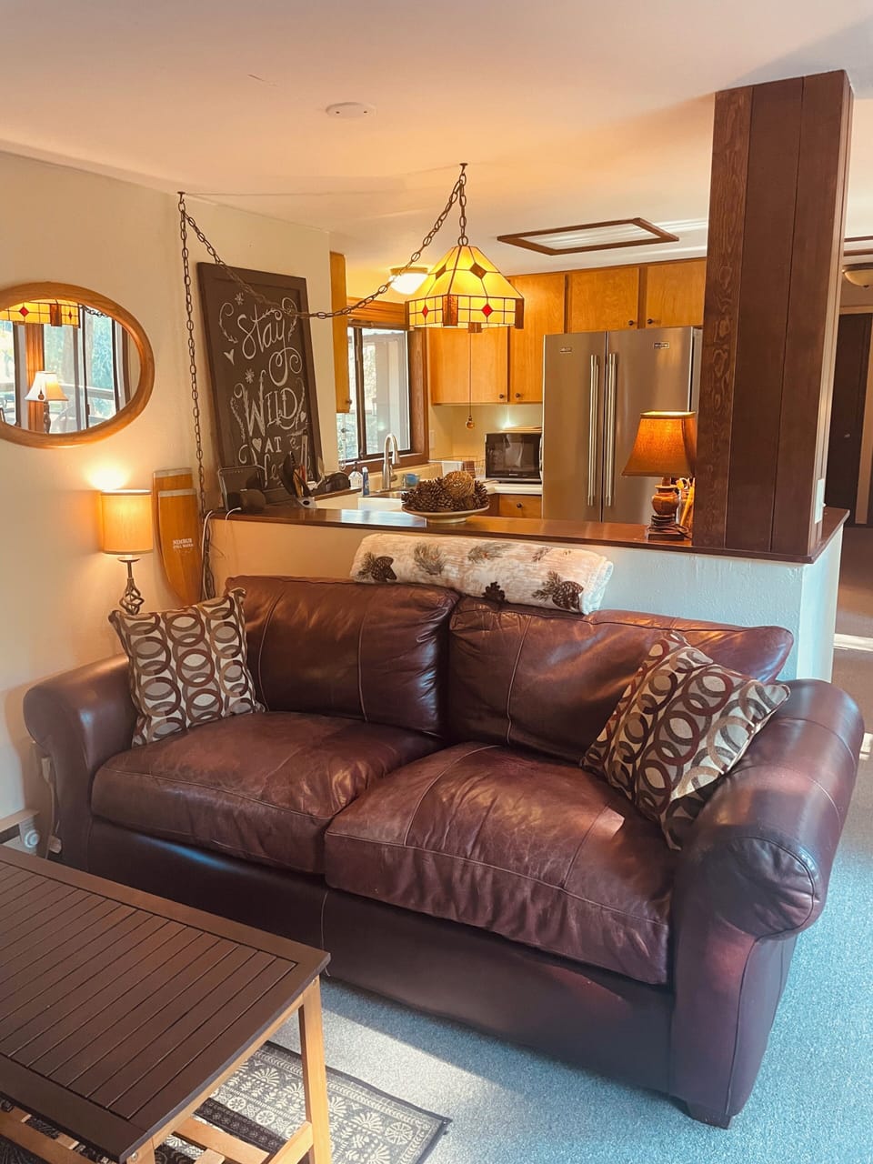 Leather couch and kitchen