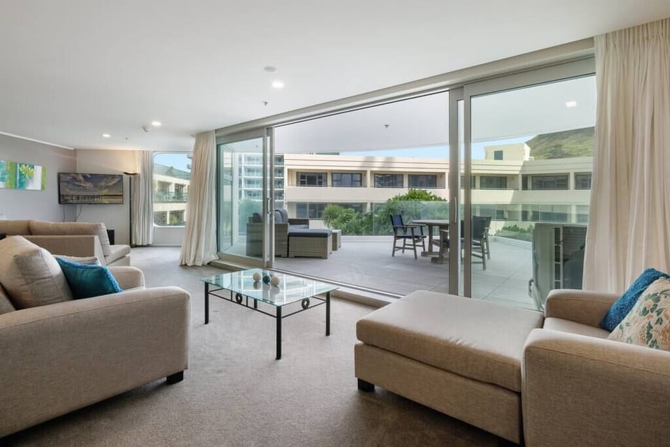 Spacious living area opening to large deck