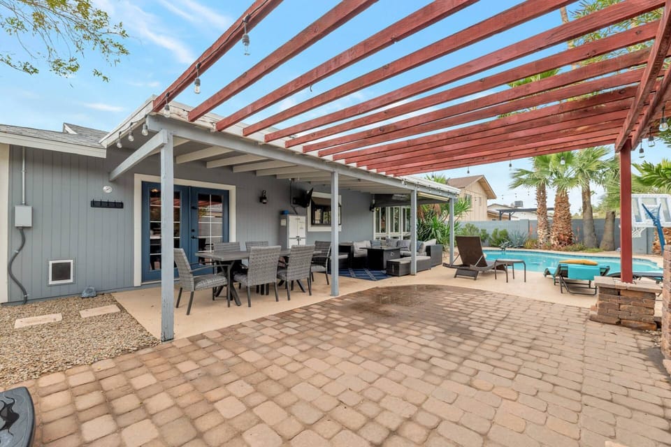 Enjoy the outdoor living space with seating and a flat screen TV