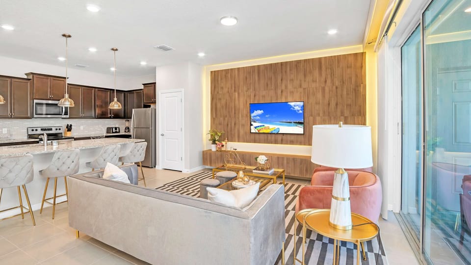 Spacious living room area with cozy sofa, perfect for family reunion or movie night!