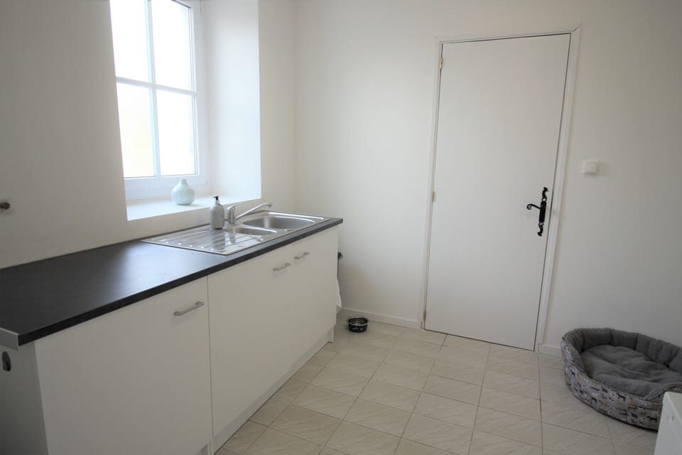 Utility room with washing machine and downstairs WC