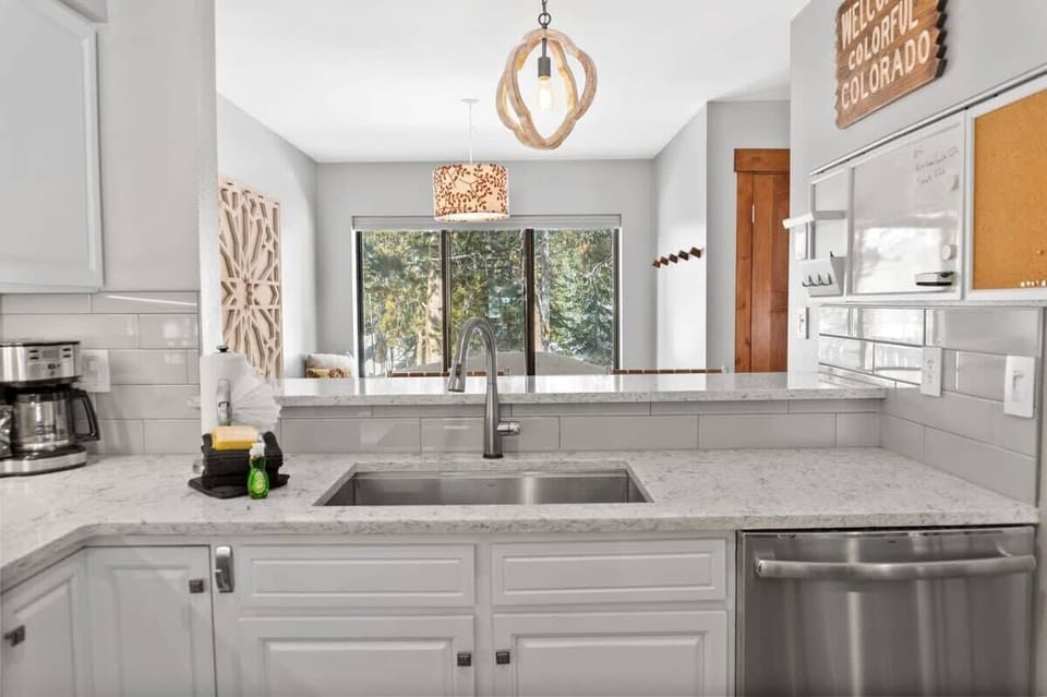The view from the kitchen towards the dining room where you will find a large window providing a great view towards the surrounding trees.