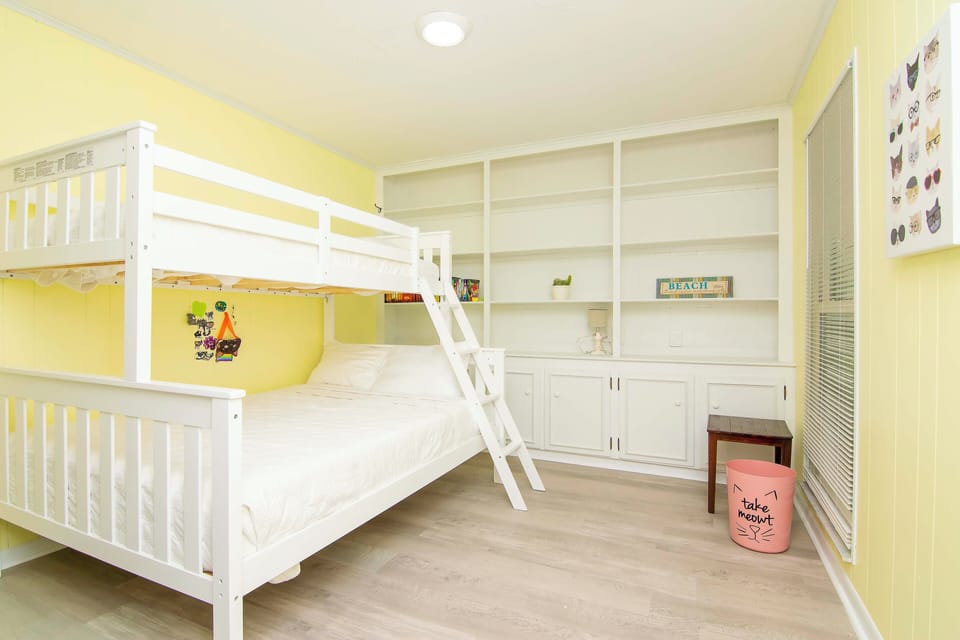 Bunk bedroom with twin top and full bottom bunk.