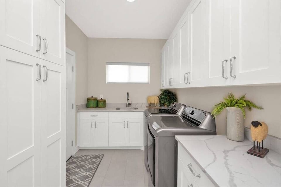 Laundry room with extra large washer and dryer.