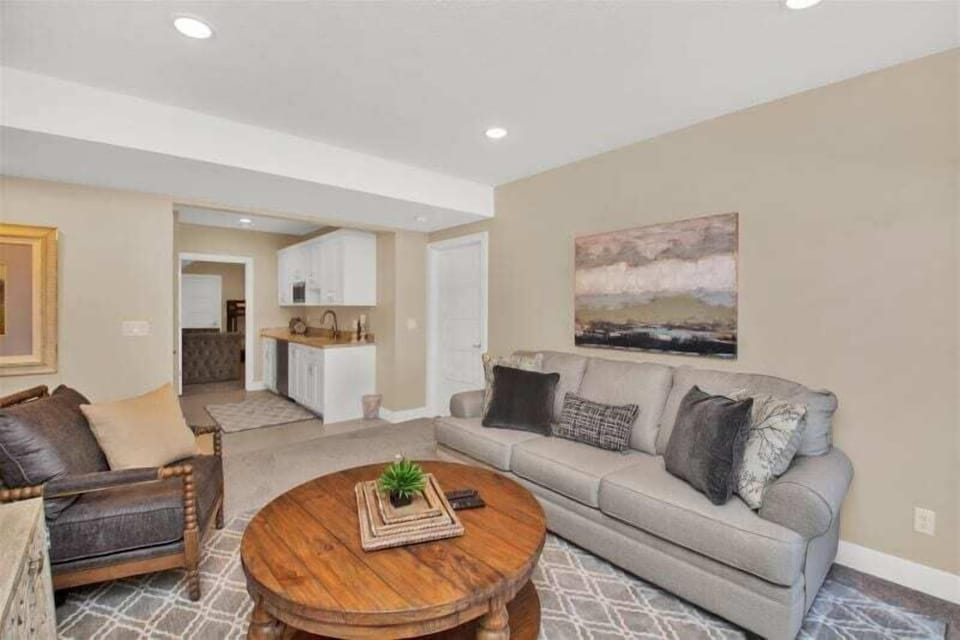 Downstairs living area with outdoor patio and kitchenette.