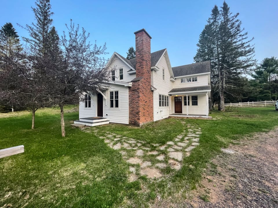 The view from the front of the house. Gravel driveway is on the right.