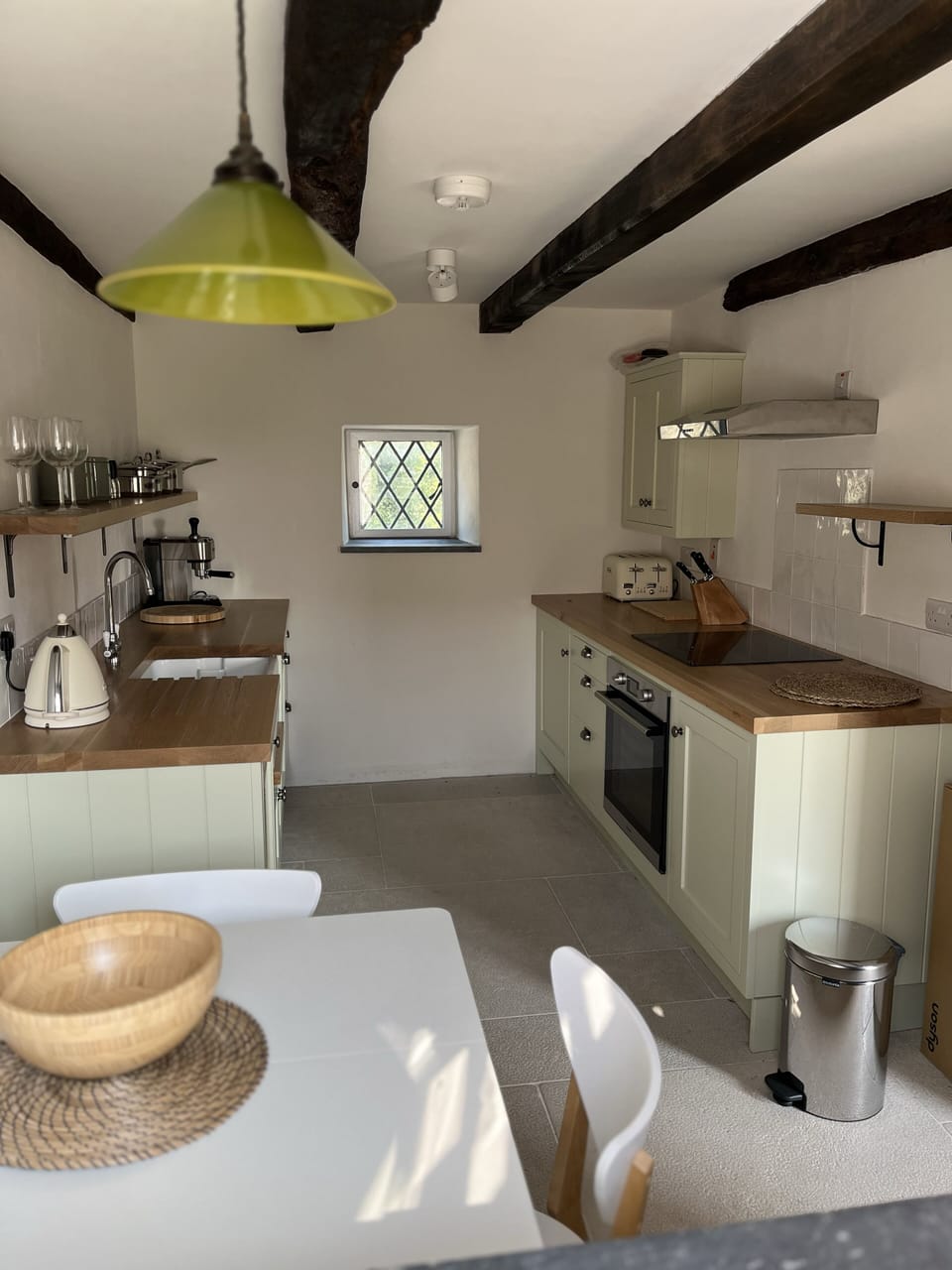 Fully-equipped country style cottage kitchen with dining