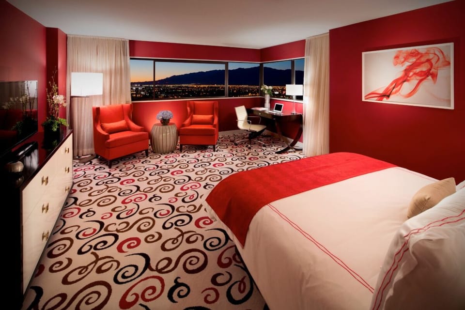 Sip a nightcap while the skyline glows beyond the windows.