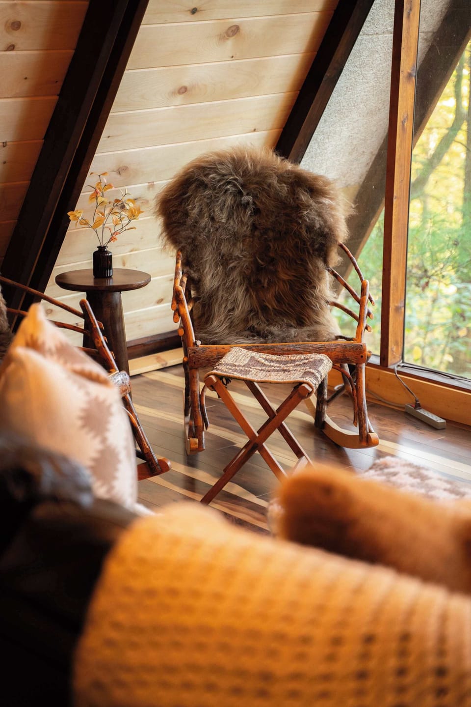 Sitting Room: Relax in this stylish retreat, featuring unique decor and stunning woodland views!