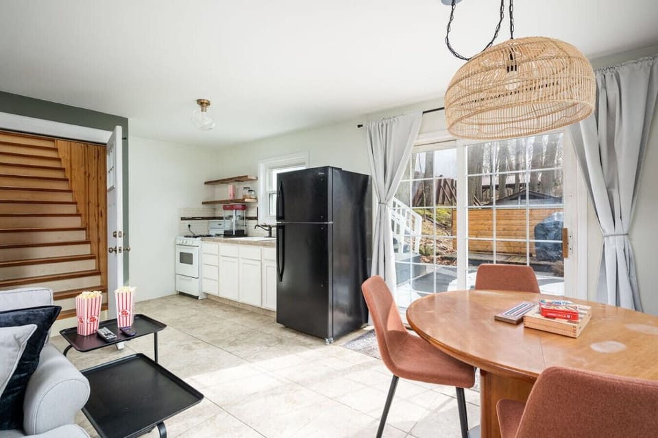 The second kitchen in the basement makes for easy meals. With walk-out access to the outdoor patio and dining area, you'll enjoy the ease of cooking, grilling, and group meals overlooking the lake.